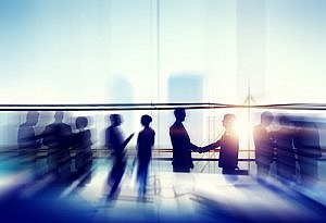 Discussing recruitment strategy at a networking event
