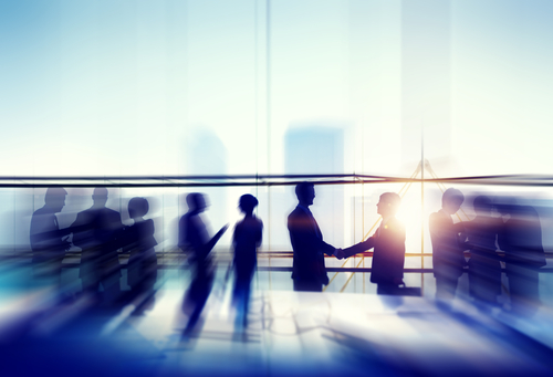 Recruiters discussing strategy at a networking event