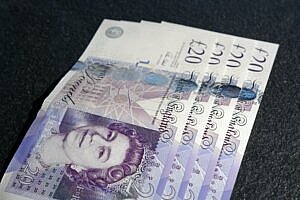 Management Consultancy Salaries 2023 - four £20 notes laid out on a table